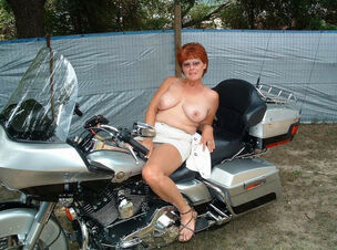 The wifey of a biker posing on a..