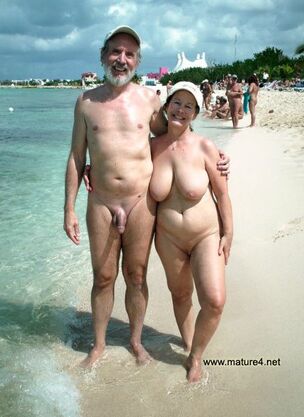 Mature bashful nudists on the beach